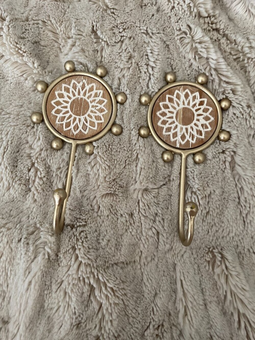 Wild Sage sunflower gold-toned decorative wall hooks with a carved wood accent